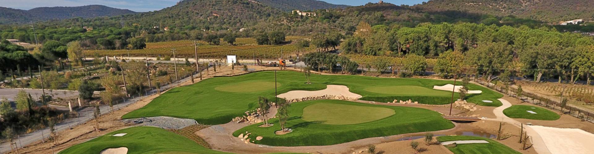 Southwest Greens outdoor putting green aerial view featuring multiple holes, sand bunkers, and rolling hills and vineyard backdrop.